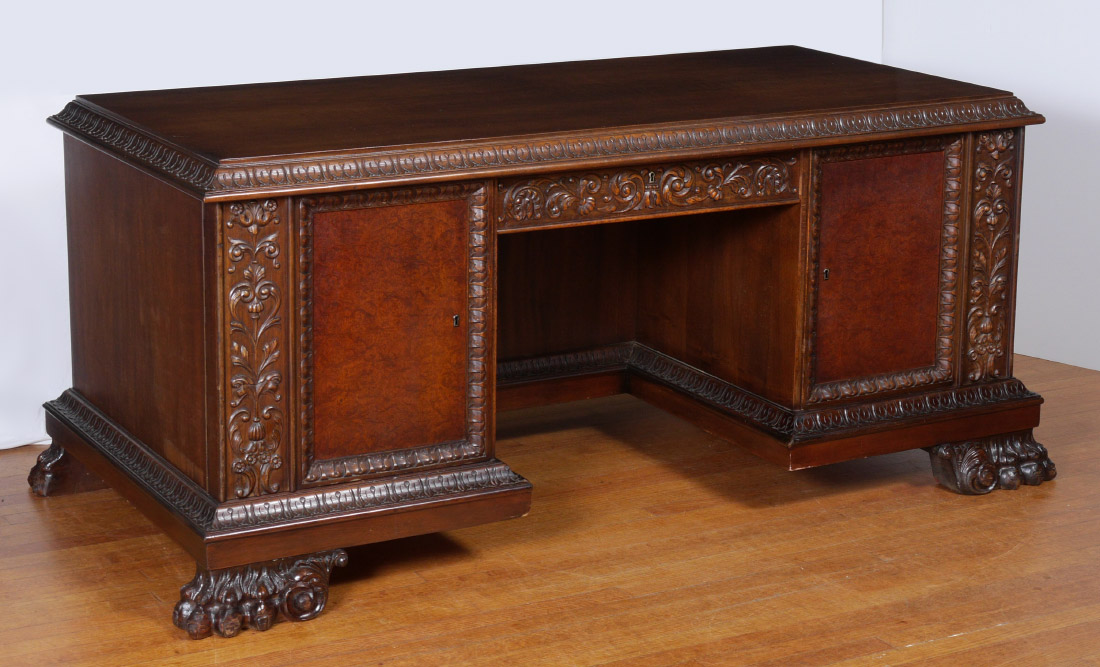 Appraisal: LARGE BURLWOOD PAW FOOT EXECUTIVE DESK Top with carved shaped