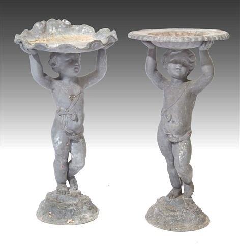 Appraisal: A PAIR OF ANTIQUE LEAD BIRD BATHS in the form