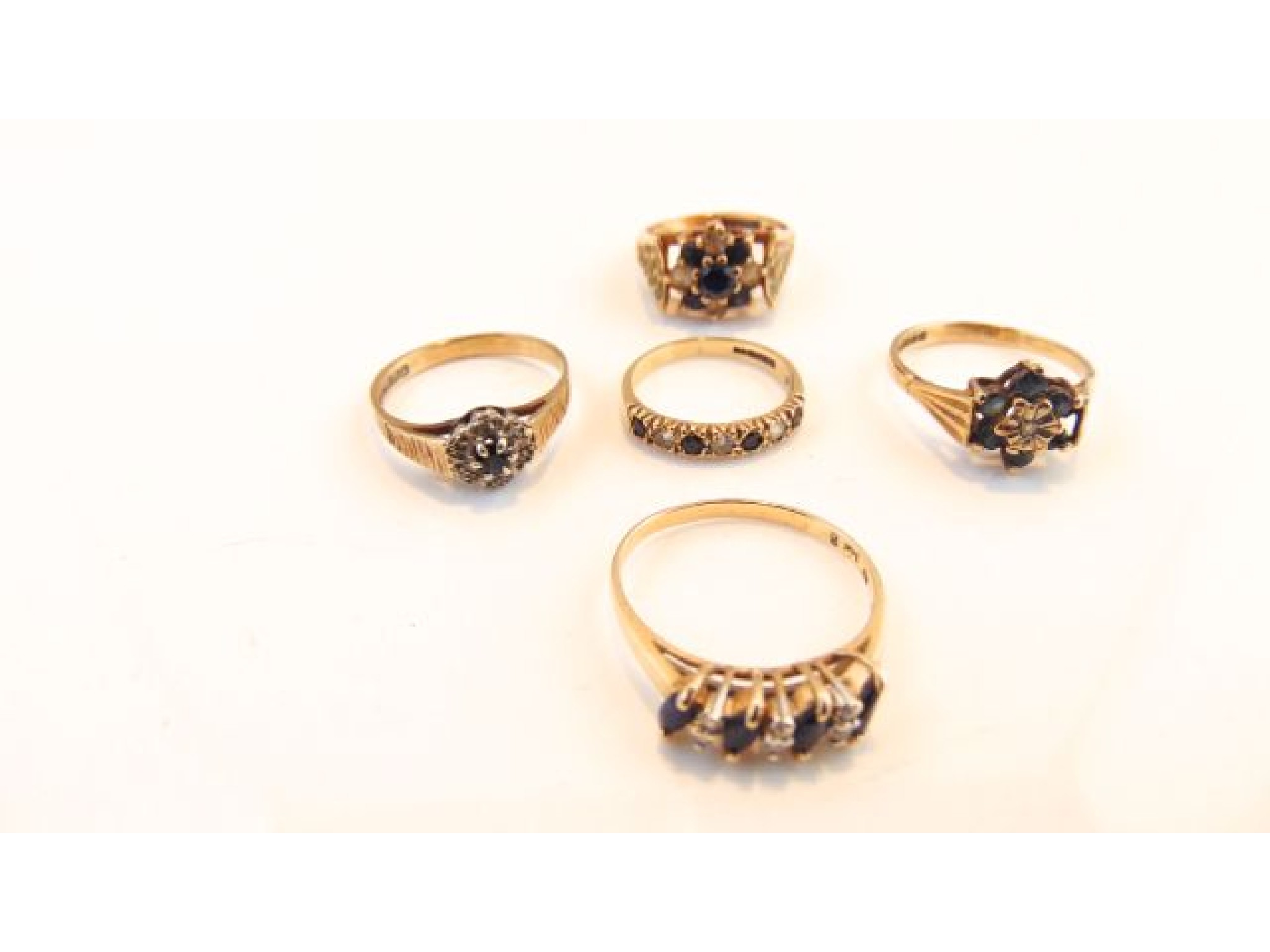 Appraisal: A sapphire and diamond ring set with four marquise-cut untested