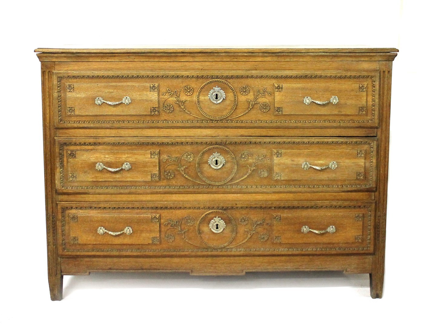 Appraisal: A th century French oak commode of three long drawers