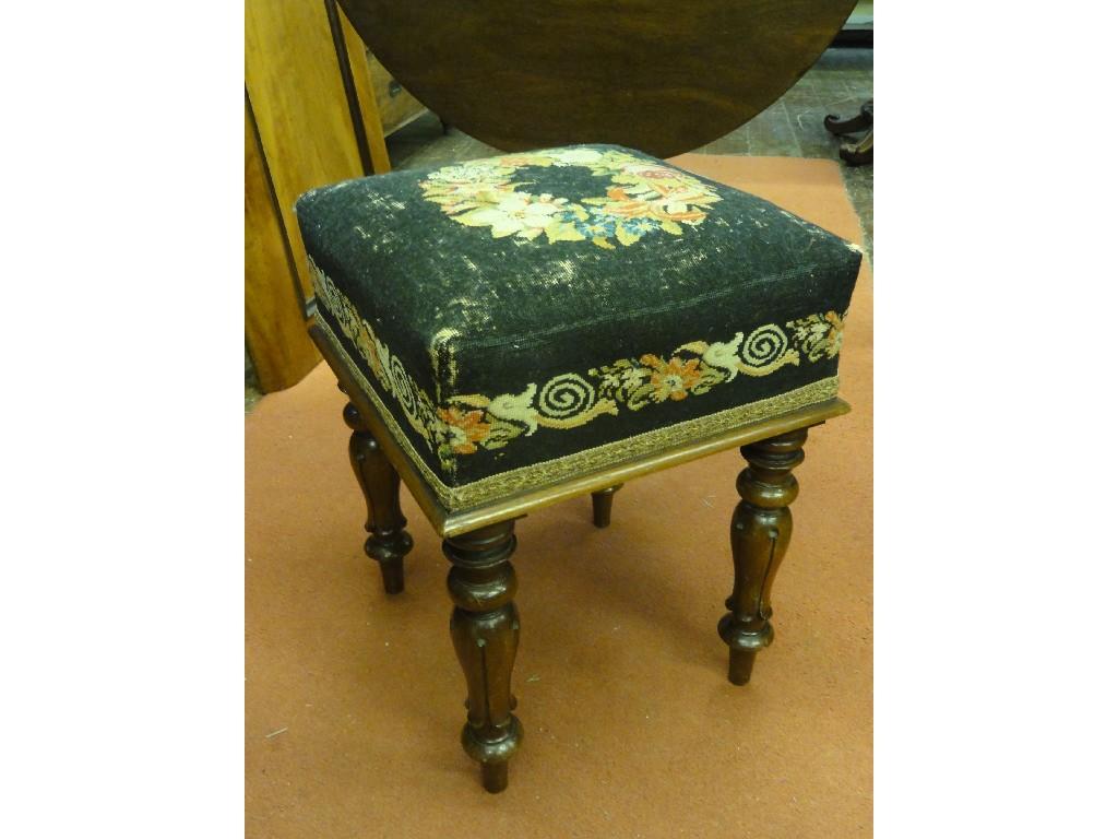 Appraisal: A Victorian mahogany stool with deep floral tapestry upholstered seat