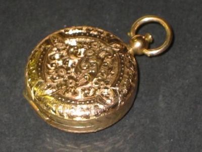 Appraisal: A VICTORIAN GOLD PENDANT LOCKET of circular form chased with