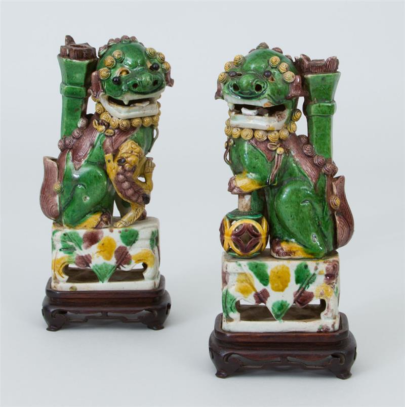 Appraisal: Pair of Chinese Sancai Glazed Porcelain Buddhistic Lions Each with