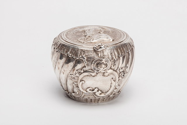 Appraisal: A CONTINENTAL SILVER LIDDED POT of fluted baluster form with