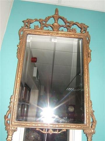 Appraisal: A decorative Georgian style gilt wall mirror with urn finial