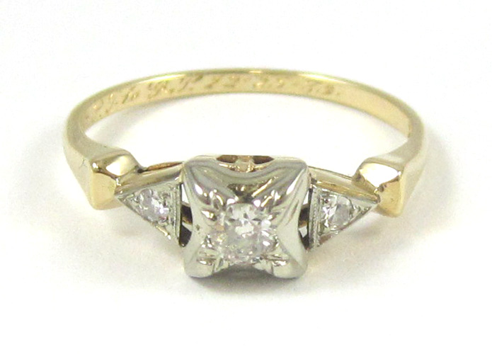 Appraisal: DIAMOND AND FOURTEEN KARAT GOLD RING The white and yellow