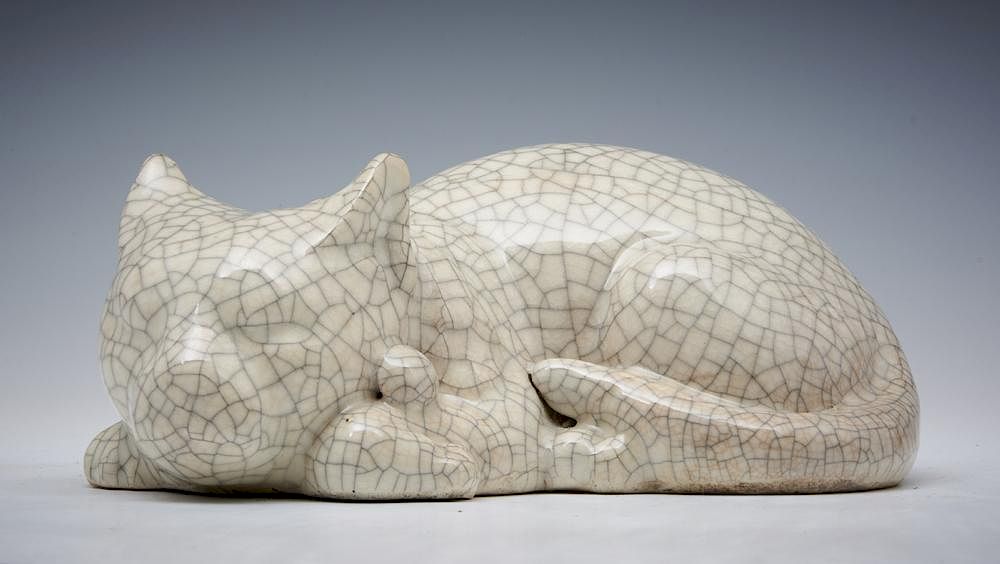 Appraisal: Japanese crackle glaze porcelain cat Japanese porcelain sleeping cat wearing