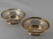 Appraisal: A pair of sterling silver pierced baskets with ribbon and