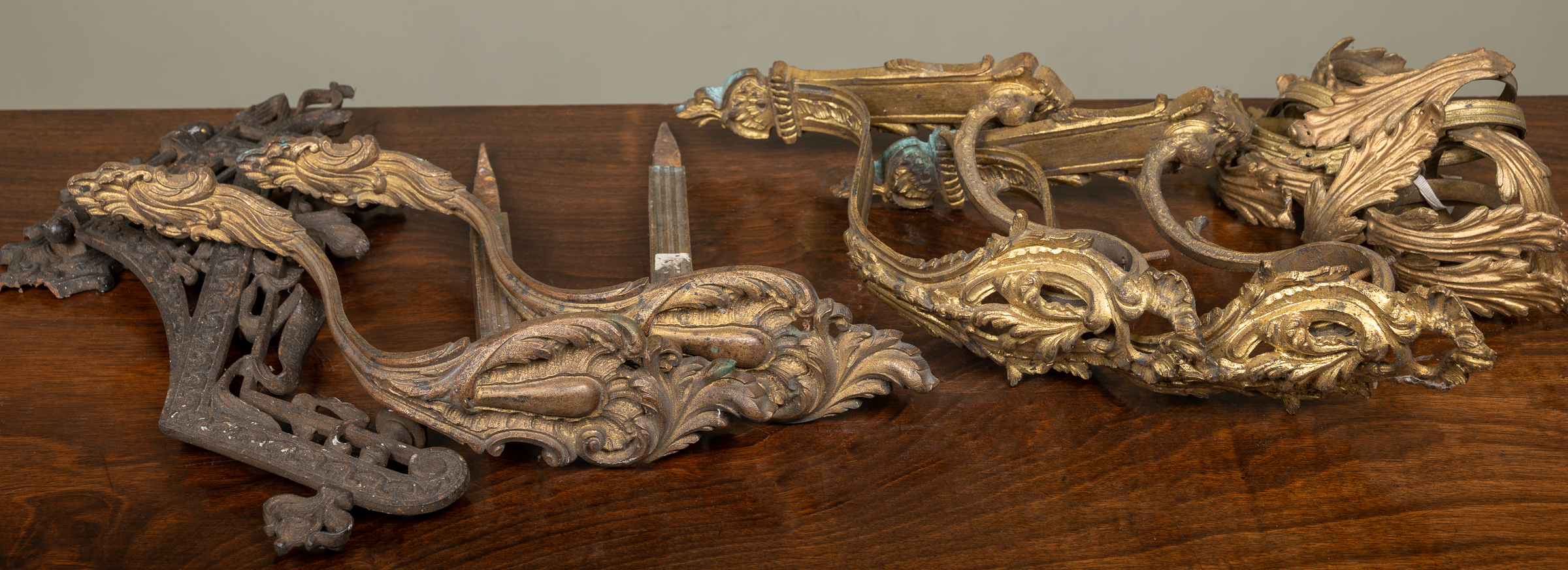 Appraisal: Two pairs of French gilt metal curtain pole brackets each