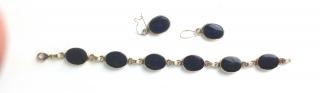 Appraisal: k y g bracelet having oval bezel set onyx and