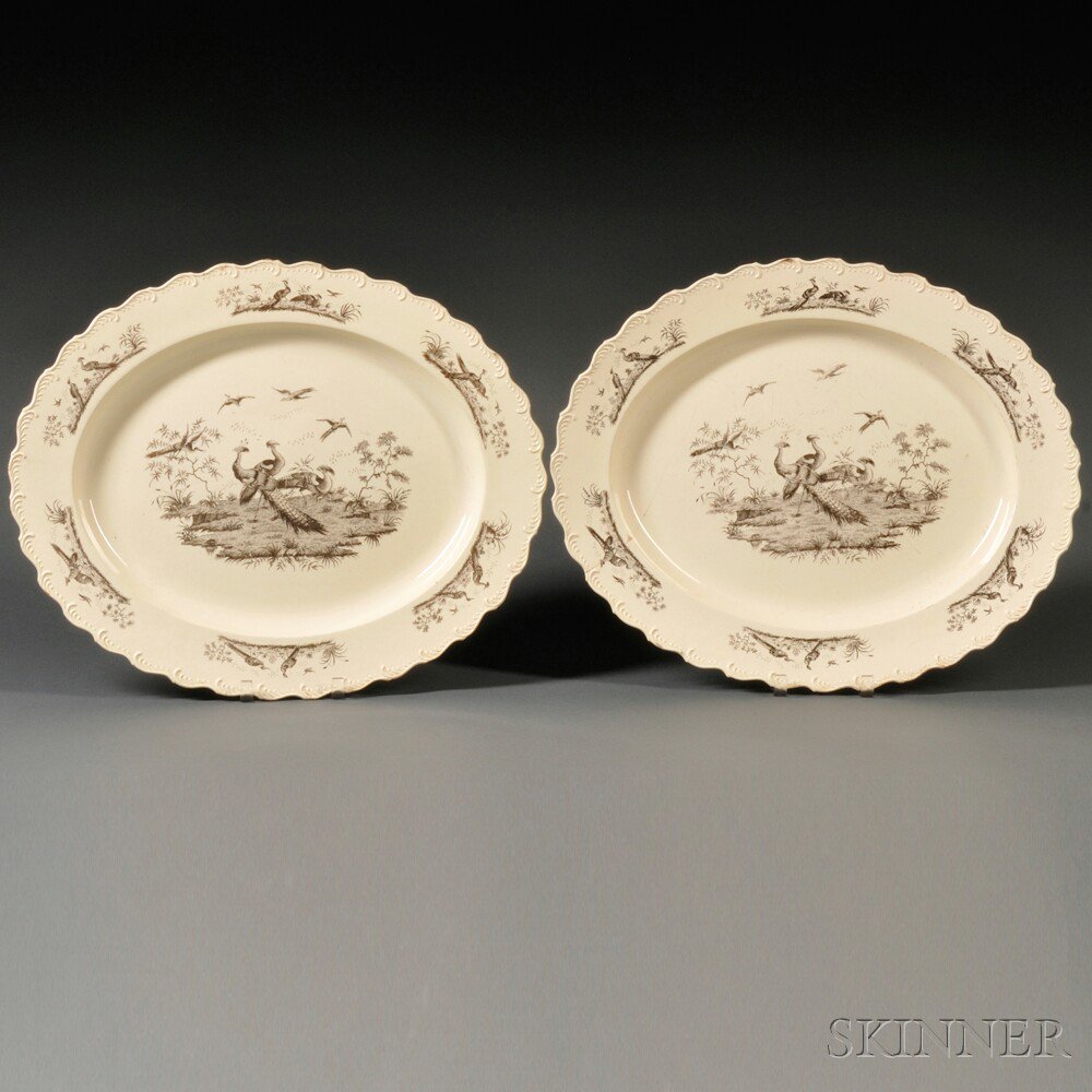 Appraisal: Two Staffordshire Cream-colored Earthenware Platters England c each oval with