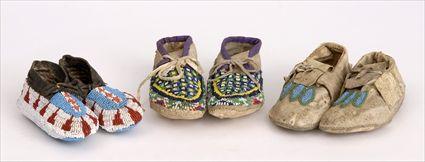 Appraisal: THREE PAIRS OF BEADED-HIDE CHILD'S MOCCASINS Including a pair of