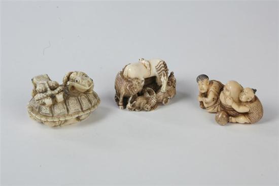 Appraisal: THREE IVORY CARVINGS Japanese th century Two netsukes frogs on