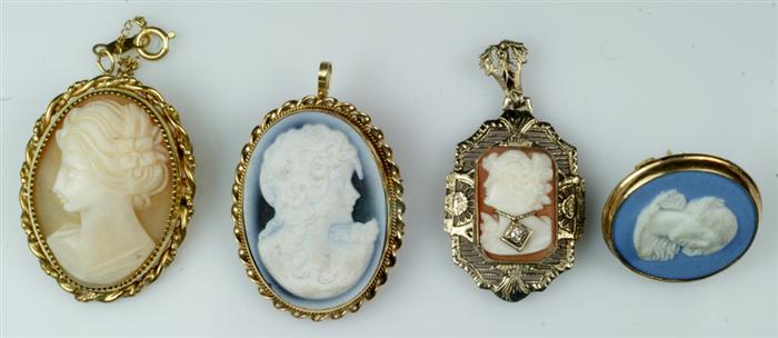 Appraisal: small cameo pins in marked K frame others unmarked Estimate