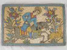 Appraisal: A Persian tile panel of a huntsman on horseback probably