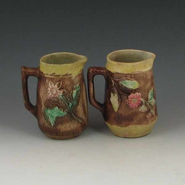 Appraisal: Two Majolica Woven Basket and Flowers Pitchers unmarked ''h left