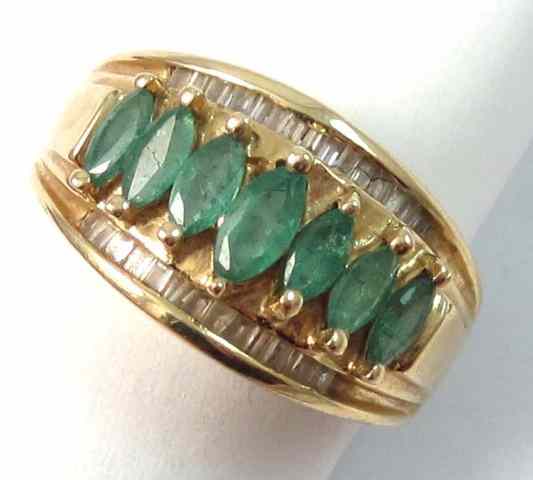 Appraisal: EMERALD DIAMOND AND FOURTEEN KARAT GOLD RING with seven marquise-cut