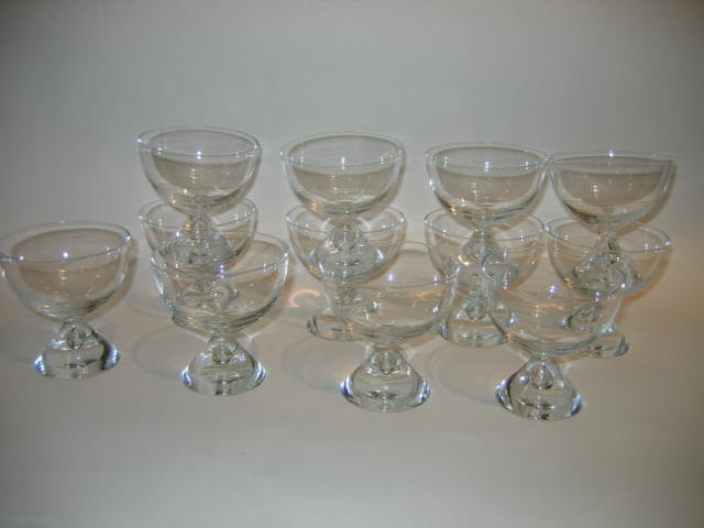 Appraisal: TWELVE SHERBERT GLASSES raised on conical supports with blown tear-drop