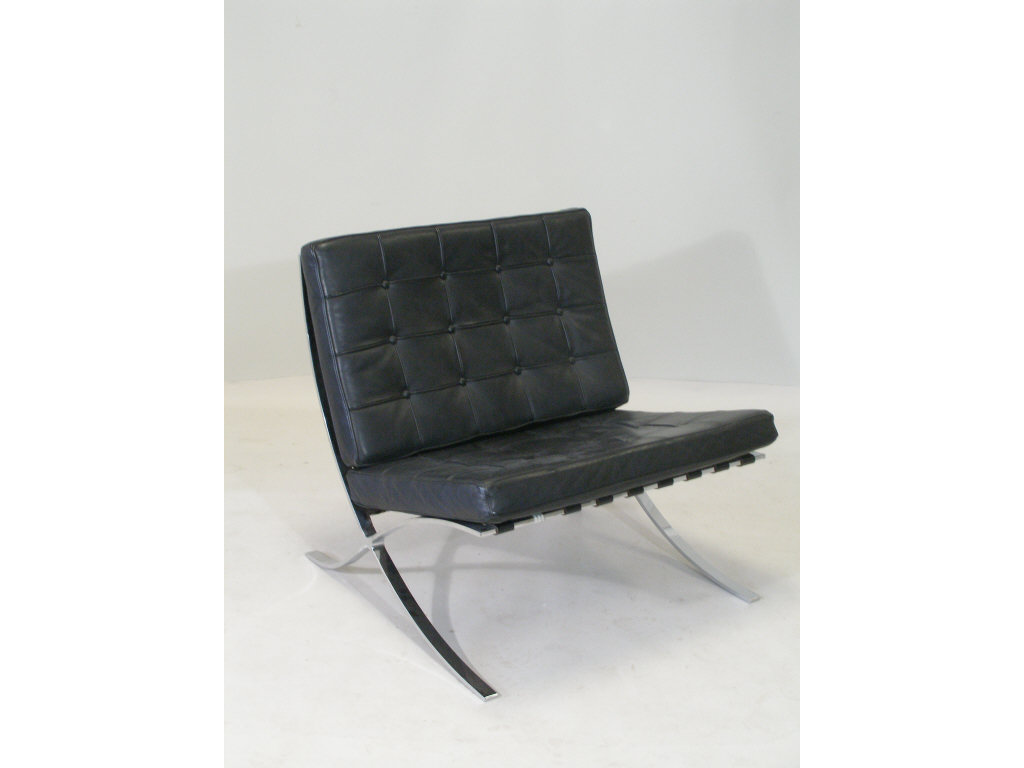 Appraisal: Barcelona Chair stainless steel frame with black leather cushions This