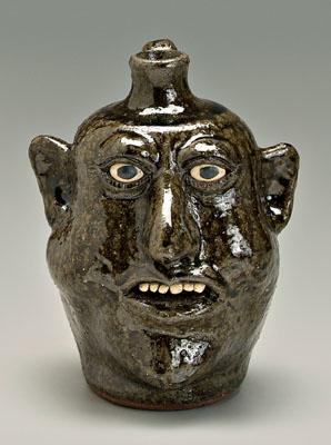 Appraisal: Lanier Meaders face jug runny medium alkaline glaze stoneware ceramic