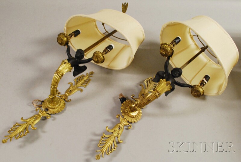 Appraisal: Pair of Neoclassical-style Part-ebonized Gilt-bronze Figural Two-light Wall Sconces with