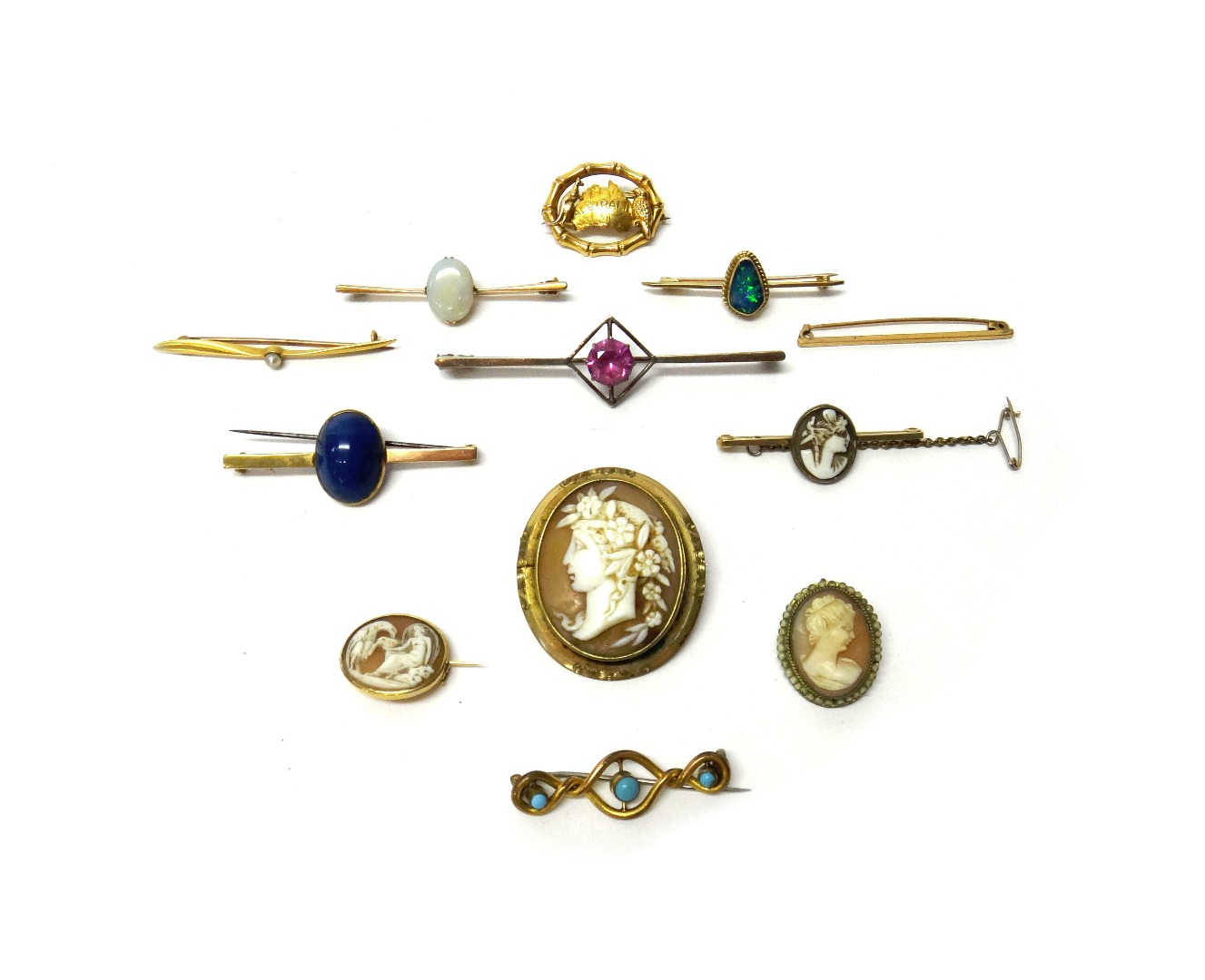 Appraisal: A gold bar brooch claw set with an oval opal