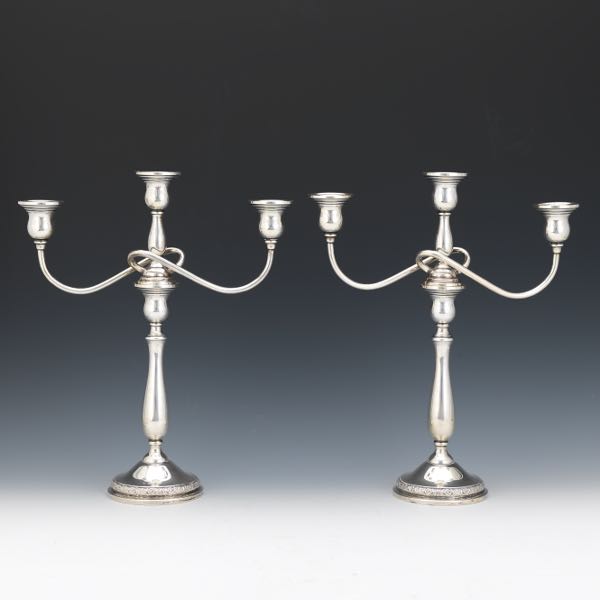 Appraisal: A PAIR OF INTERCHANGEABLE CANDELABRA BY INTERNATIONAL STERLING PRELUDE PATTERN