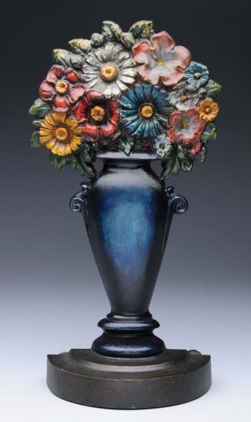 Appraisal: Cast Iron Mixed Flowers In Urn Doorstop Made by Bradley