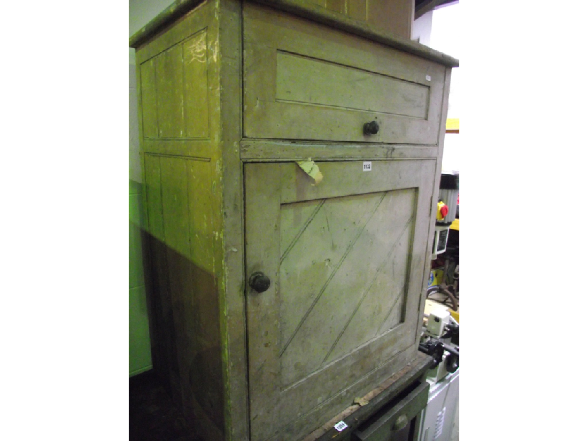 Appraisal: A Victorian pine side cabinet with rising lid enclosing a