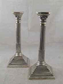 Appraisal: A pair of silver Corinthian column candlesticks with Masonic presentation