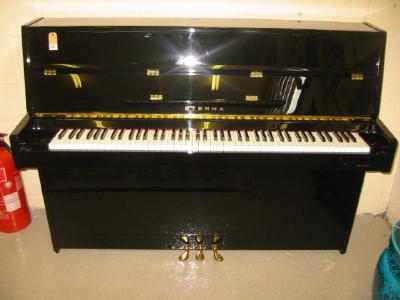 Appraisal: AN ETERNA YAMAHA UPRIGHT PIANO the overstrung movement with three