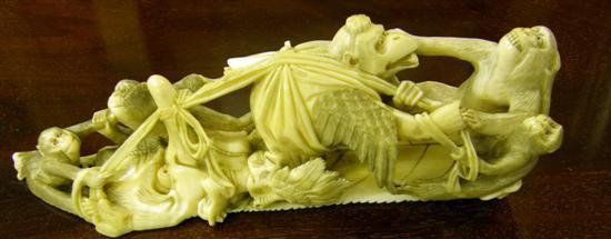 Appraisal: AN ORIENTAL AMUSING IVORY OKIMONO carved with monkeys and winged