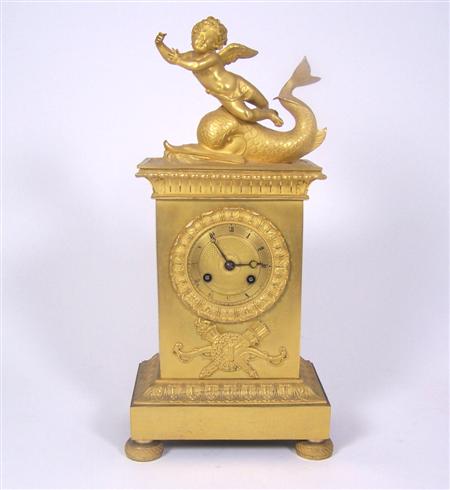 Appraisal: A French Empire gilt bronze mantel clock the engine turned