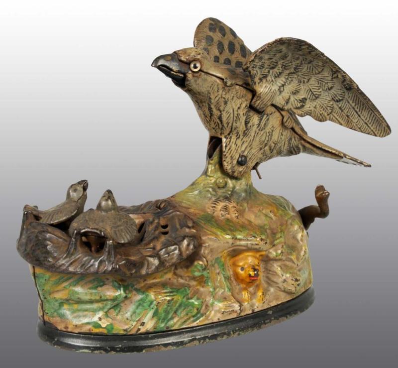 Appraisal: Cast Iron Eagle Eaglettes Mechanical Bank Description Manufactured by J