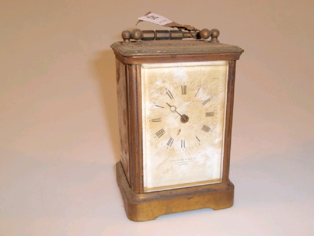 Appraisal: An early thC brass cased carriage clock the white dial