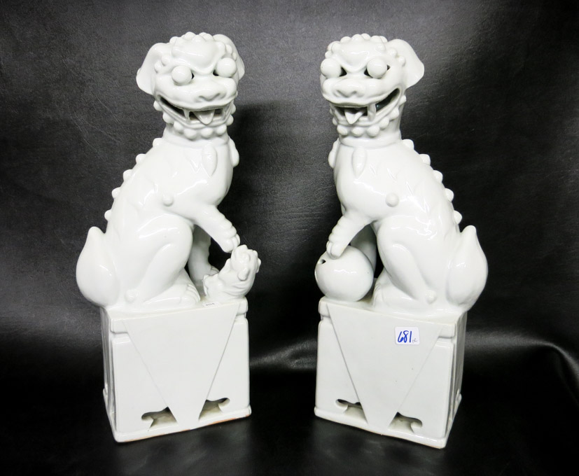 Appraisal: PAIR OF CHINESE BLANC DE CHINE PORCELAIN FOO-DOGS the seated