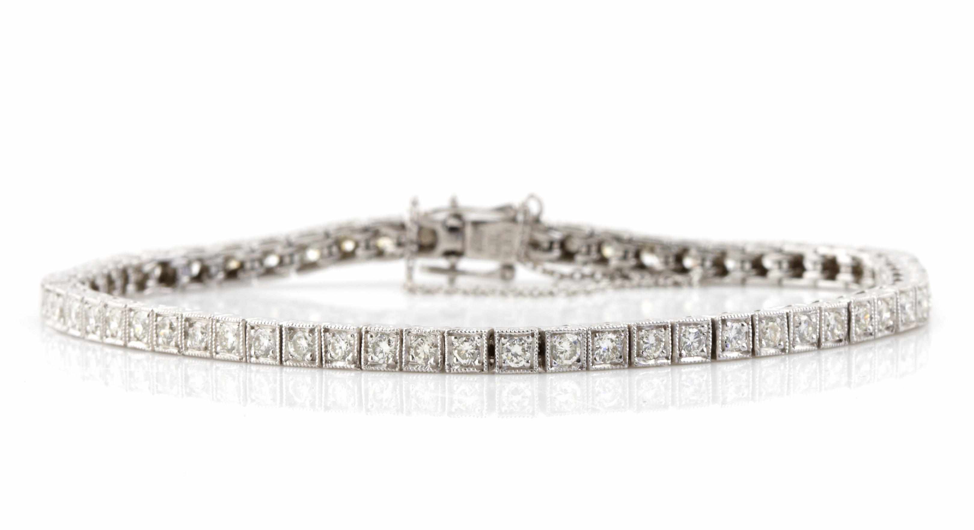 Appraisal: A diamond and platinum line bracelet estimated total diamond weight