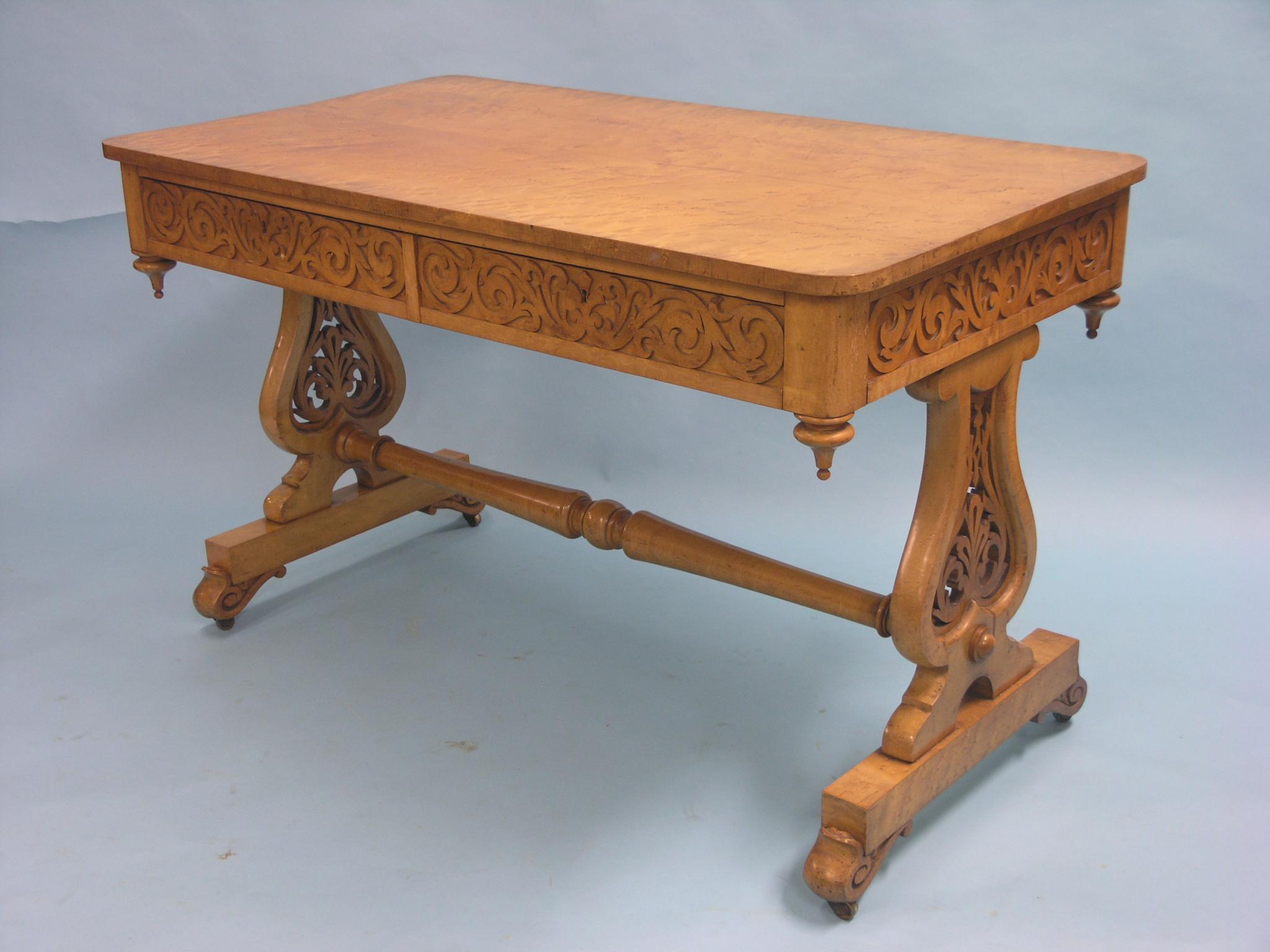 Appraisal: A Victorian 'bird's-eye' maple library table rectangular-shape with two frieze