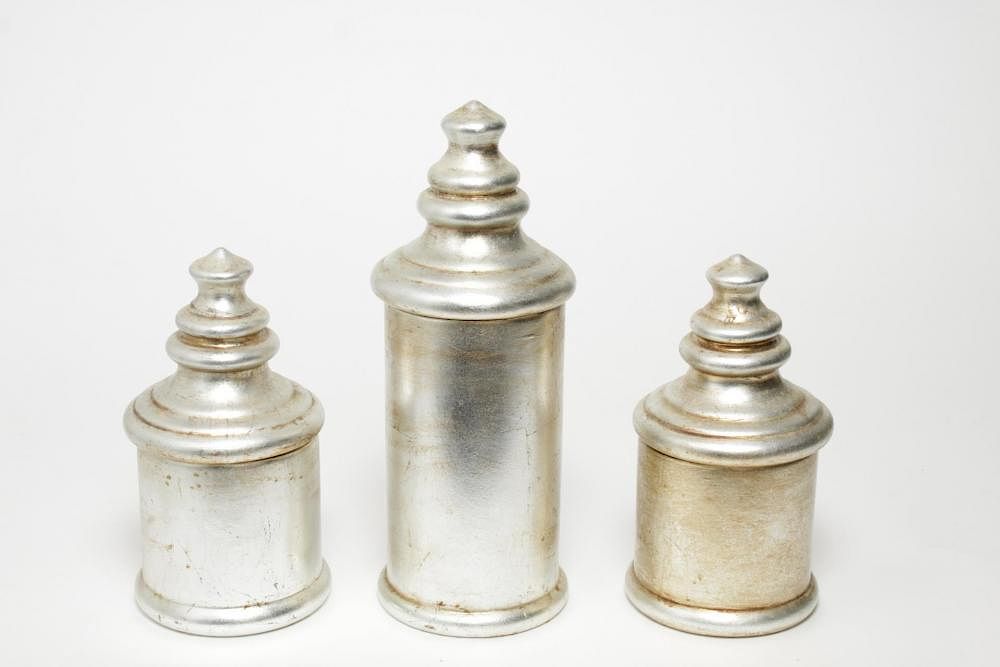 Appraisal: Silver-Gilt Porcelain Canister Set Group of Silver-gilt porcelain covered canister