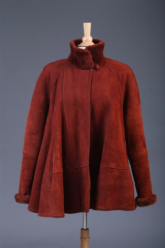 Appraisal: KARL LAGERFELD RUST-COLORED SUEDE AND SHEARLING COAT Retailed Revillon size