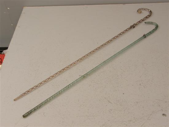 Appraisal: Two th century glass walking canes one with purple spiral