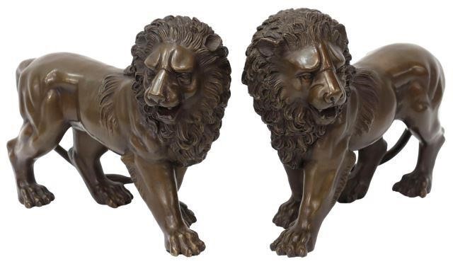 Appraisal: pair Patinated bronze sculptures Walking Lions with well-detailed manes approx