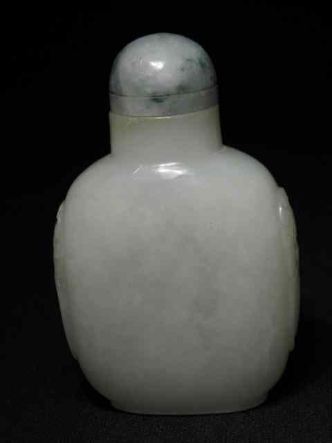 Appraisal: A Chinese carved pale green jade snuff bottle with a