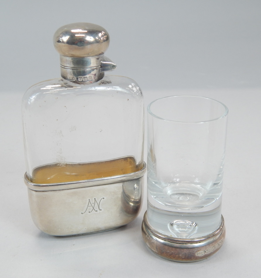 Appraisal: A small Edwardian silver and glass hip flask with a