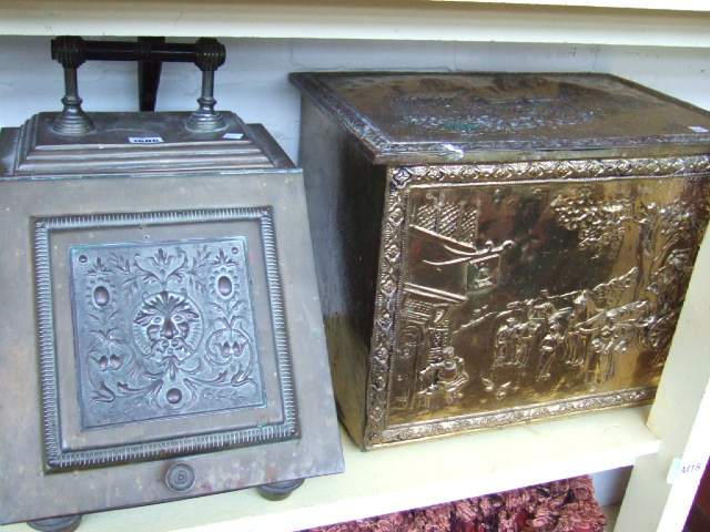 Appraisal: A brass coal box relief moulded with village scenes and