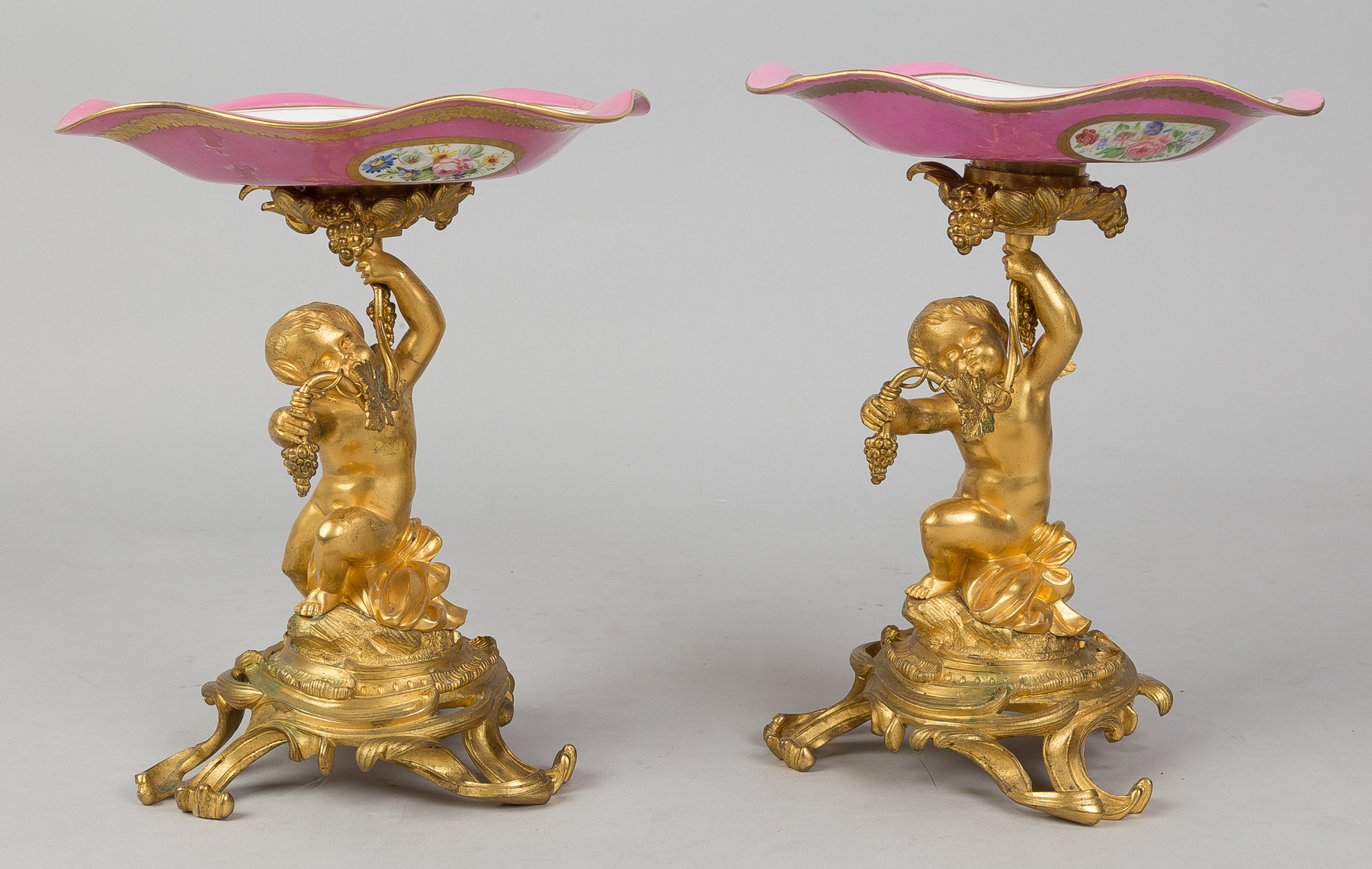 Appraisal: Pair Gilt Bronze Cherub Compotes th century with hand painted