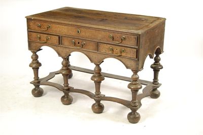 Appraisal: An oak dressing table the boarded elm top above one