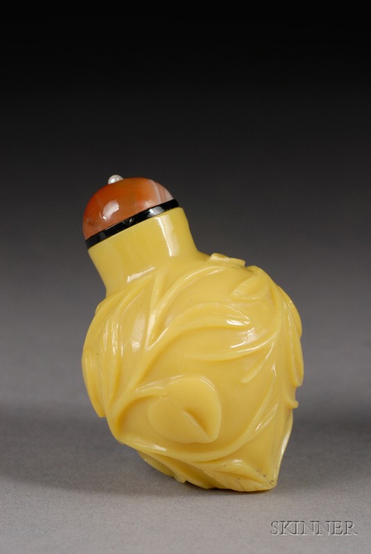 Appraisal: Peking Glass Snuff Bottle th century yellow glass carved as