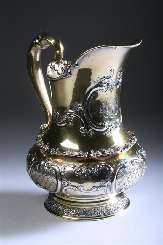 Appraisal: TIFFANY CO PARCEL-GILT STERLING SILVER REPOUSS WATER PITCHER Circa pattern