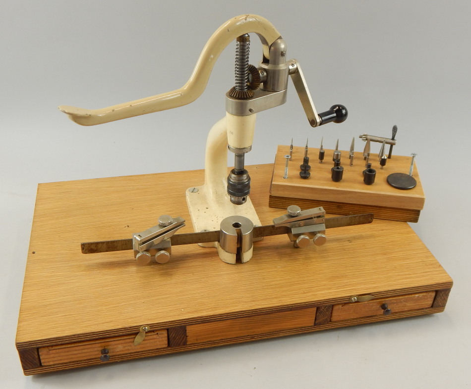 Appraisal: A clock or watch maker's drill with various attachments on